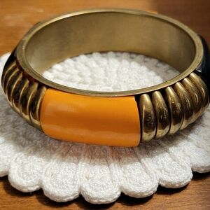 Orange, Bras And Black Bangle Bracelet
